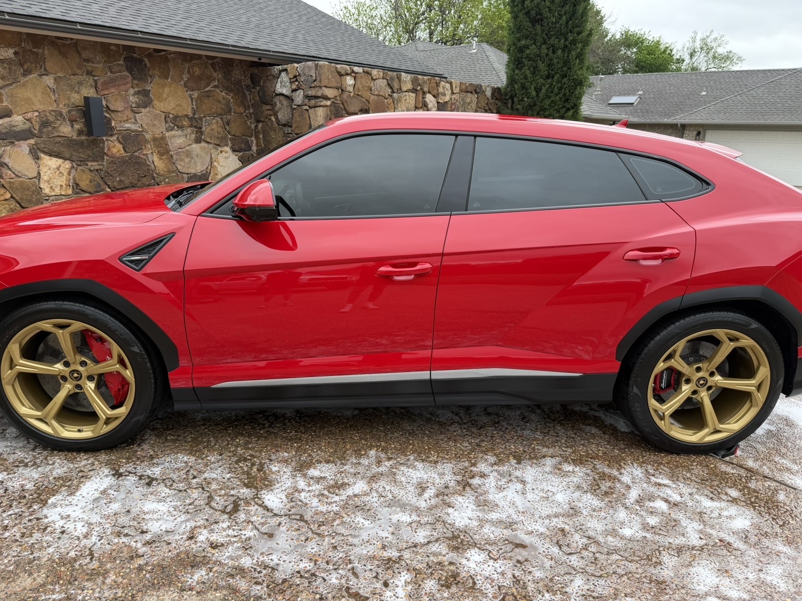 Lamborghini Urus side profile with gold wheels